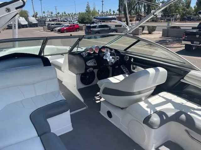 Slide: The Image of Interior of 2006 MasterCraft X45 boat with white and gray seating. - 10
