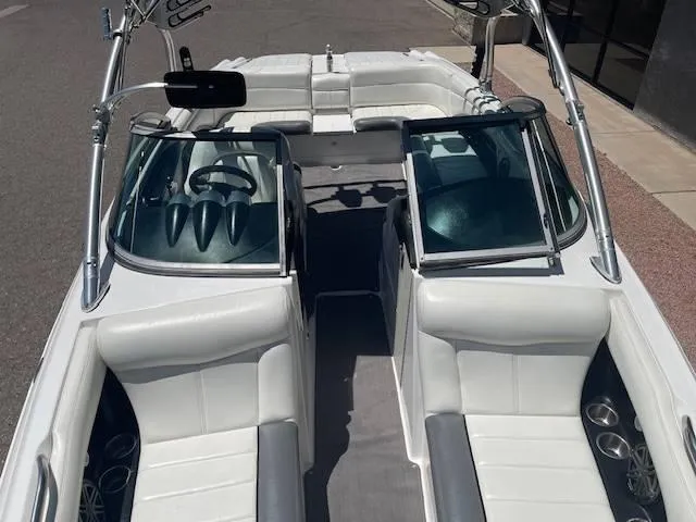 Slide: The Image of 2006 MasterCraft X45 boat interior with white seating and sleek design. - 11