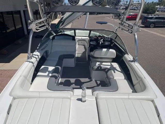 Slide: The Image of 2006 MasterCraft X45 boat interior with white seating and wakeboard racks. - 6