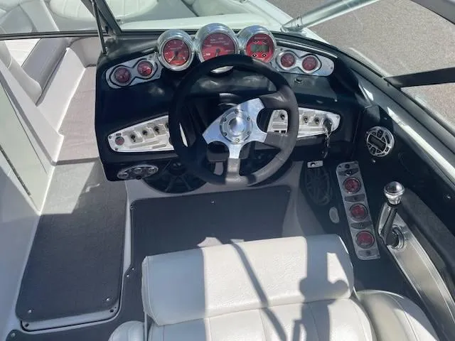 Slide: The Image of 2006 MasterCraft X45 boat dashboard with steering wheel and gauges. - 8