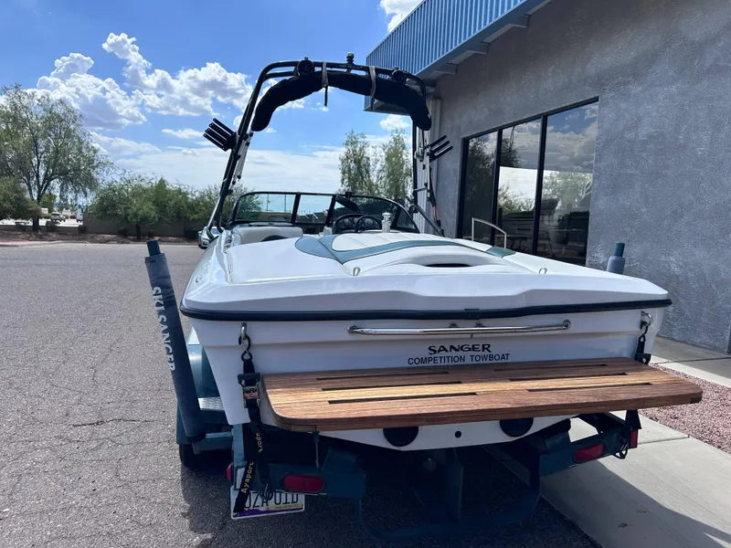 Slide: The Image of 2003 Sanger Z210 competition towboat parked outdoors, rear view. - 3
