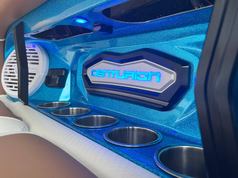 Slide: The Image of 2025 Centurion Ri245 interior with blue accents and cup holders. - 10