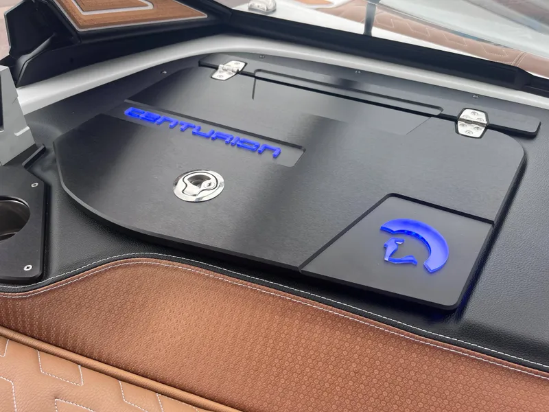 Slide: The Image of 2025 Centurion Ri245 boat interior with sleek design and illuminated logo. - 11