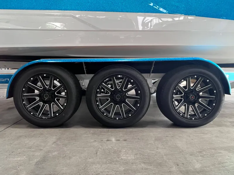 Slide: The Image of Centurion Ri245 2025 boat trailer with three stylish black alloy wheels. - 17