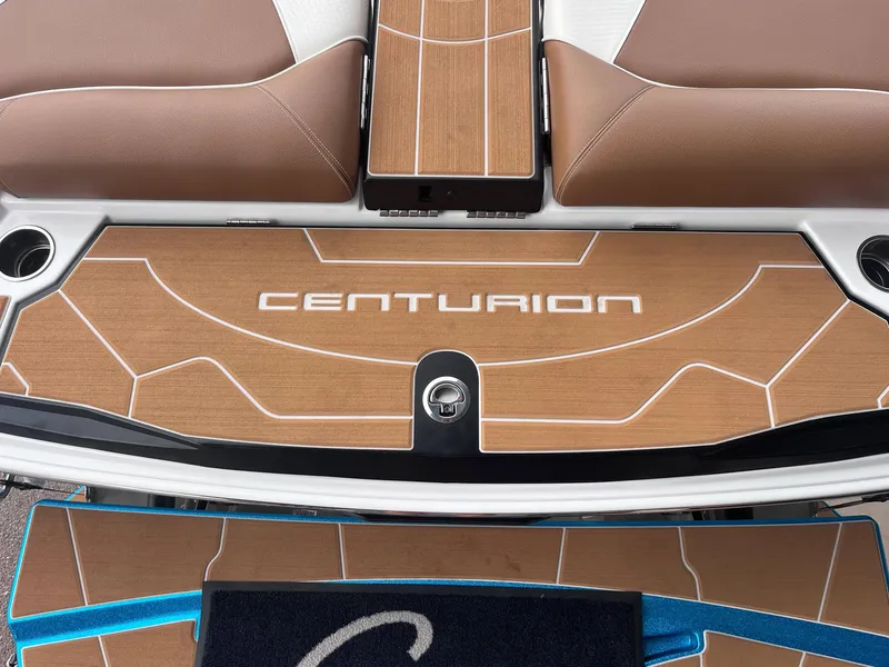Slide: The Image of 2025 Centurion Ri245 boat deck with brown and white design. - 6