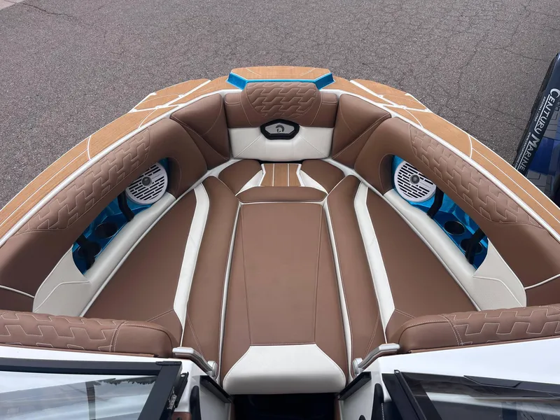 Slide: The Image of Luxurious interior of 2025 Centurion Ri245 boat with brown and white seating. - 7