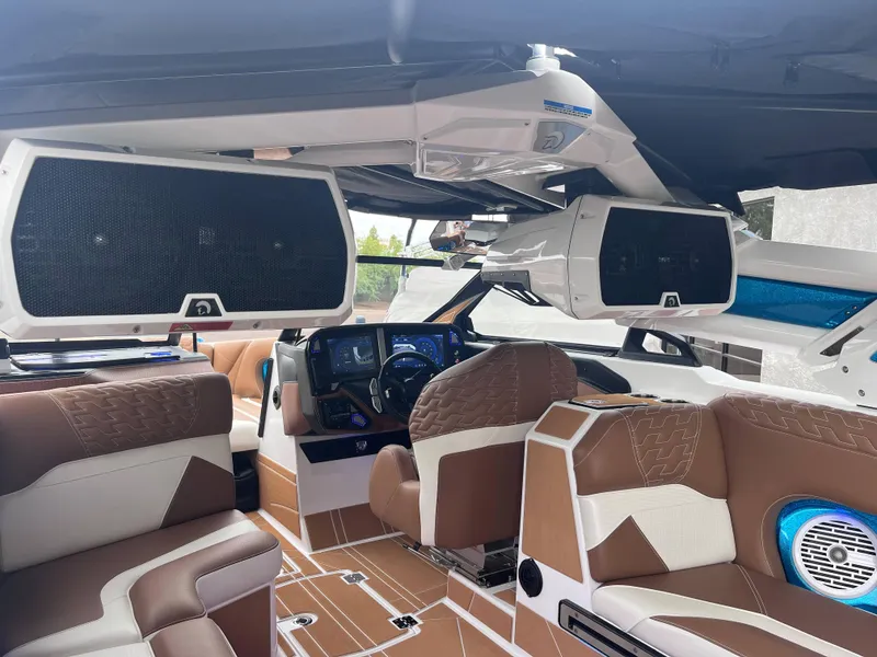 Slide: The Image of Luxurious interior of 2025 Centurion Ri245 boat with advanced dashboard and premium seating. - 8