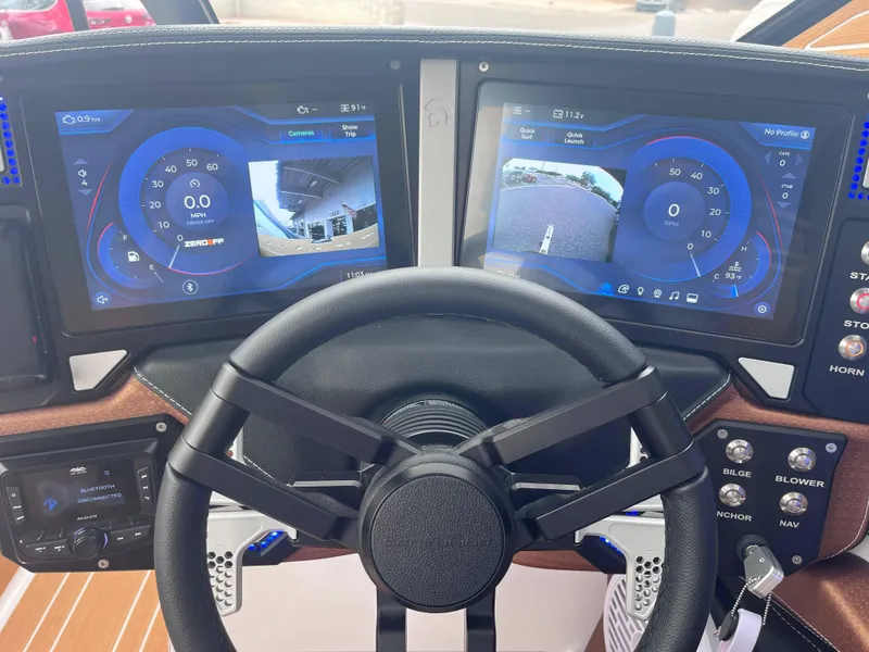 Slide: The Image of 2025 Centurion Ri245 dashboard with dual digital displays and steering wheel. - 9