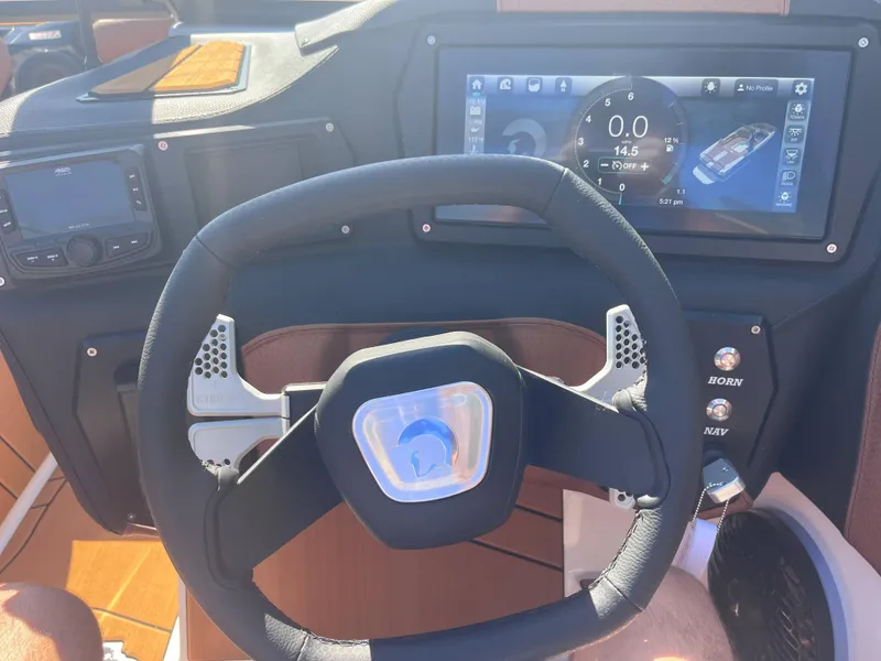 Slide: The Image of Steering wheel and dashboard of 2025 Centurion Fe23 boat with digital display. - 6