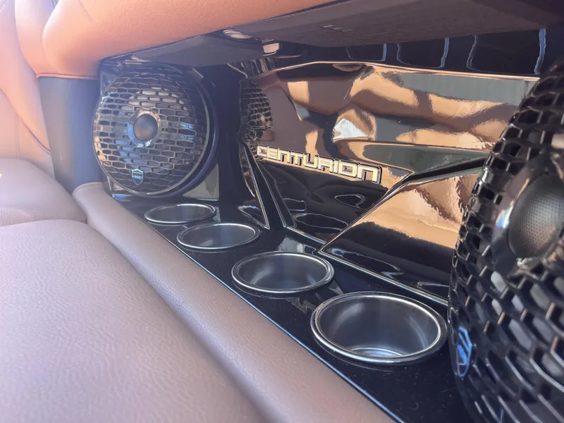 Slide: The Image of Centurion Fe23 2025 interior with speakers and cup holders, featuring sleek design elements. - 7
