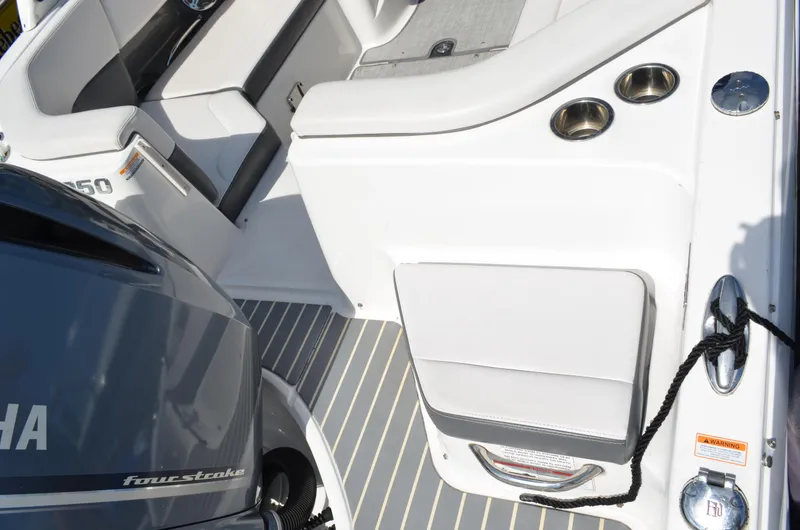 Slide: The Image of 2016 Chaparral 250 Suncoast boat interior with Yamaha four-stroke engine and seating area. - 13