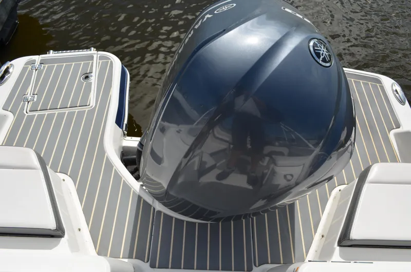 Slide: The Image of 2016 Chaparral 250 Suncoast boat with Yamaha outboard engine on water. - 14