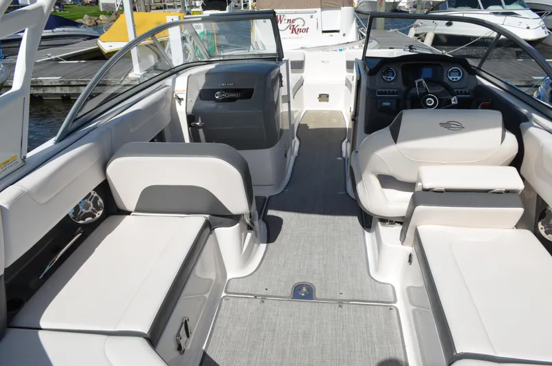 Slide: The Image of 2016 Chaparral 250 Suncoast boat interior with seating and dashboard view. - 16