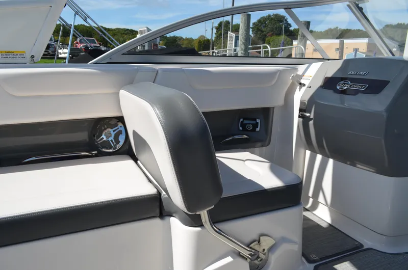 Slide: The Image of Interior of 2016 Chaparral 250 Suncoast boat, featuring seating and dashboard details. - 23