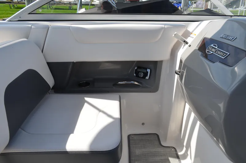 Slide: The Image of Interior view of 2016 Chaparral 250 Suncoast boat, featuring seating and control panel. - 37