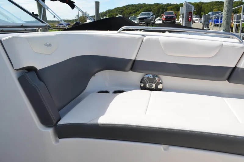 Slide: The Image of 2016 Chaparral 250 Suncoast boat interior with white and gray seating. - 38