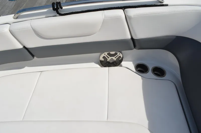 Slide: The Image of Interior seating of 2016 Chaparral 250 Suncoast boat with cup holders. - 39