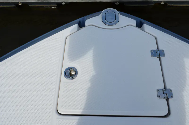 Slide: The Image of Bow hatch of 2016 Chaparral 250 Suncoast boat, featuring a clean white surface. - 40