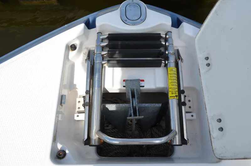 Slide: The Image of Anchor compartment of 2016 Chaparral 250 Suncoast boat with ladder and rope. - 41