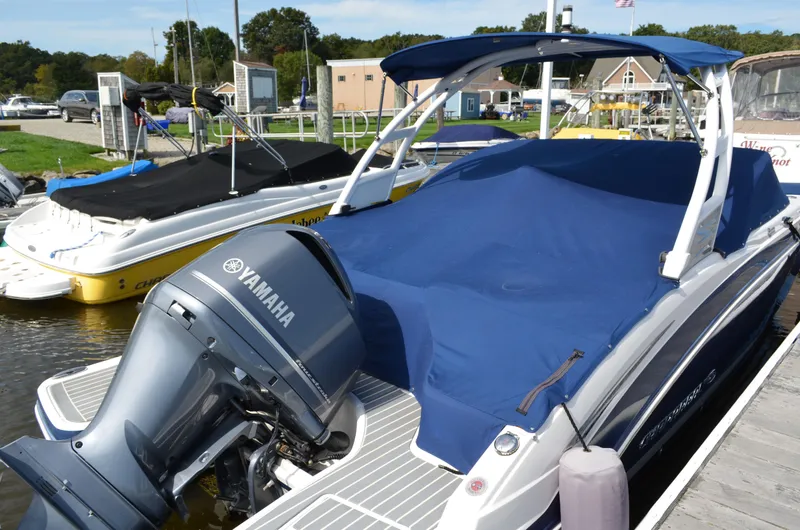 Slide: The Image of 2016 Chaparral 250 Suncoast boat with Yamaha engine, covered and docked at marina. - 8