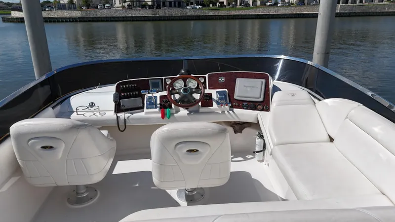 Slide: The Image of 2007 Regal 4080 Flybridge Sedan interior with white seating and control panel. - 20