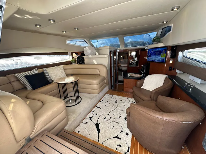 Slide: The Image of Luxurious interior of 2007 Regal 4080 Flybridge Sedan with plush seating and modern decor. - 29