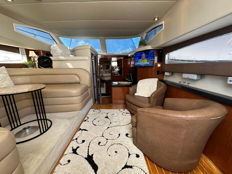 Slide: The Image of Luxurious interior of 2007 Regal 4080 Flybridge Sedan yacht with plush seating and elegant decor. - 30