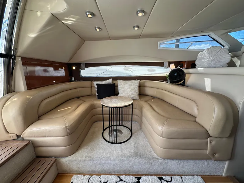 Slide: The Image of Luxurious interior of 2007 Regal 4080 Flybridge Sedan with beige leather seating. - 31