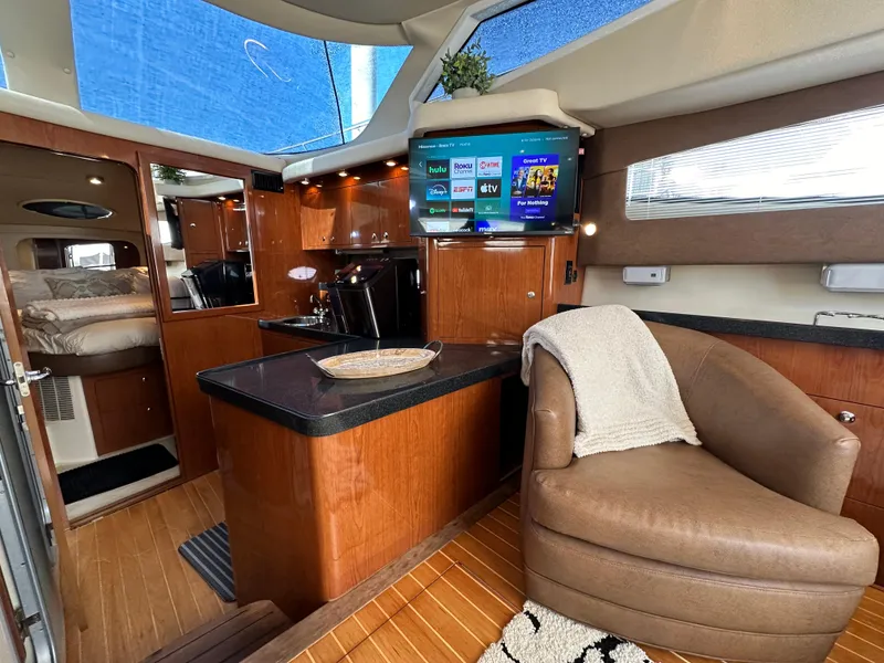 Slide: The Image of Luxurious 2007 Regal 4080 Flybridge Sedan interior with modern amenities and cozy seating. - 36