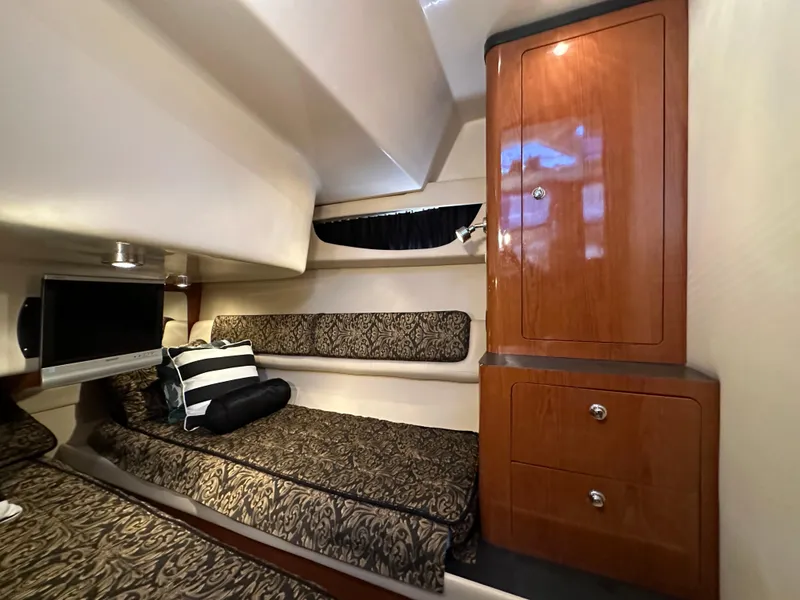Slide: The Image of Luxurious cabin interior of 2007 Regal 4080 Flybridge Sedan with elegant wood cabinetry. - 43