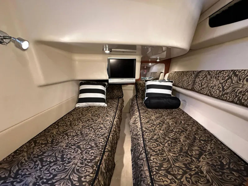 Slide: The Image of Luxurious 2007 Regal 4080 Flybridge Sedan cabin with twin beds and elegant decor. - 44