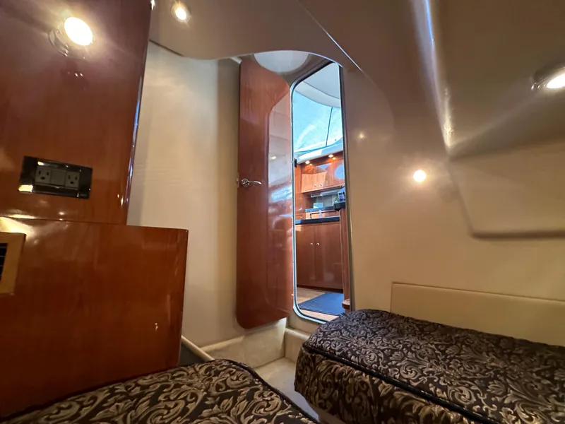 Slide: The Image of Interior of 2007 Regal 4080 Flybridge Sedan with twin beds and wood paneling. - 45