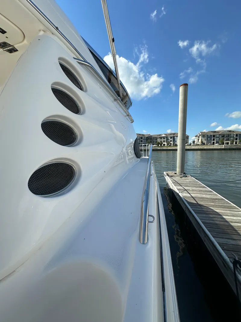 Slide: The Image of 2007 Regal 4080 Flybridge Sedan cruising on the water. - 11