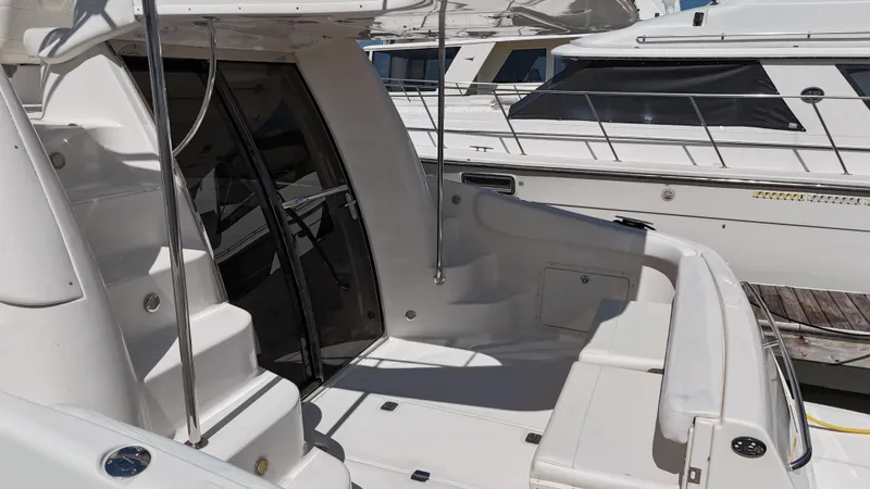 Slide: The Image of 2007 Regal 4080 Flybridge Sedan cruising on water. - 12