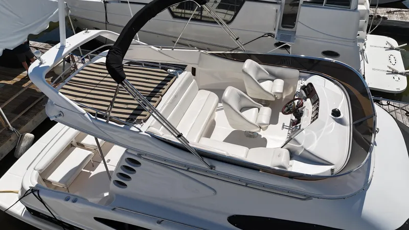 Slide: The Image of Regal 4080 Flybridge Sedan 2007 at sea with seating area. - 18