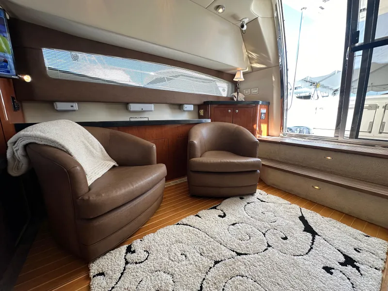 Slide: The Image of Control panel of 2007 Regal 4080 Flybridge Sedan boat with switches and gauges. - 33