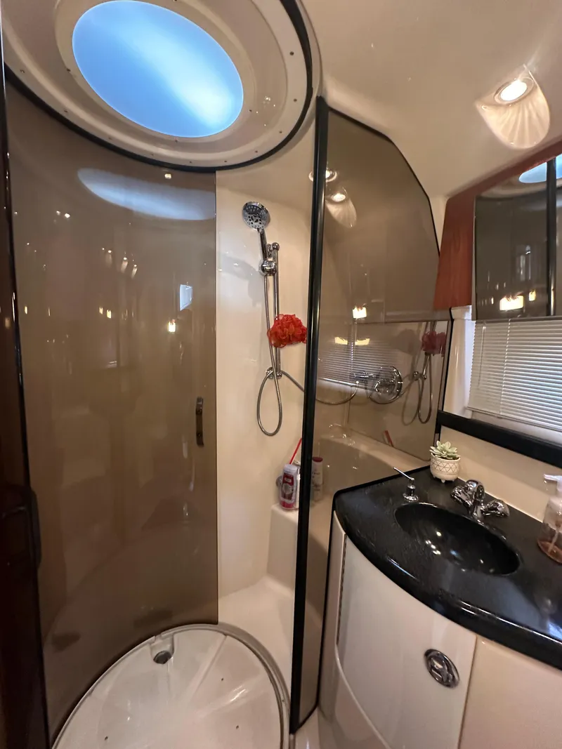 Slide: The Image of Luxurious cabin interior of 2007 Regal 4080 Flybridge Sedan with elegant wood cabinetry. - 48