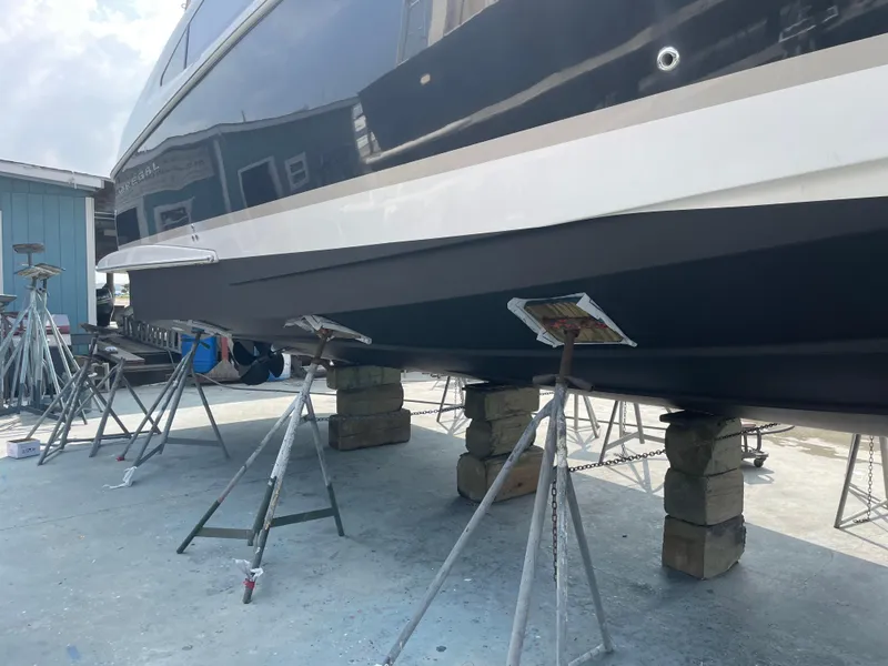 Slide: The Image of Regal 4080 Flybridge Sedan 2007 elevated for maintenance. - 64