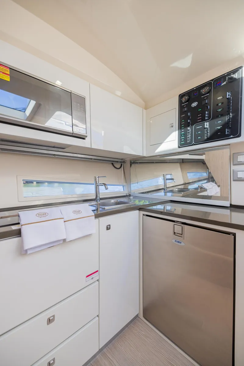 Slide: The Image of 2024 Sessa Marine C36 IB yacht kitchen with modern appliances and sleek design. - 13