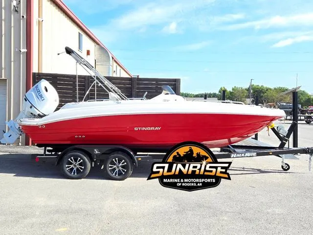 Slide: The Image of 2023 Stingray 192 SC boat in red on trailer at Sunrise Marine. - 1