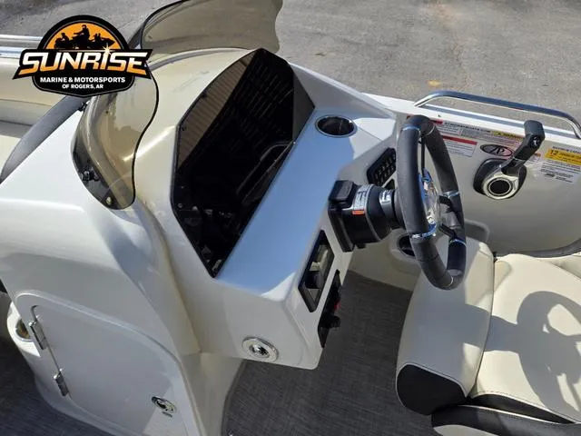Slide: The Image of 2023 Stingray 192 SC boat dashboard with steering wheel and controls, Sunrise Marine logo visible. - 10