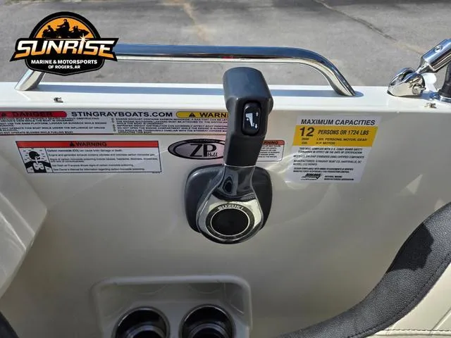 Slide: The Image of Control panel of 2023 Stingray 192 SC boat with capacity warning labels. - 12