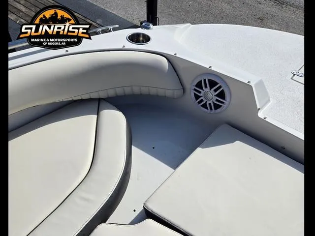 Slide: The Image of 2023 Stingray 192 SC boat interior with cushioned seating and speaker. - 19