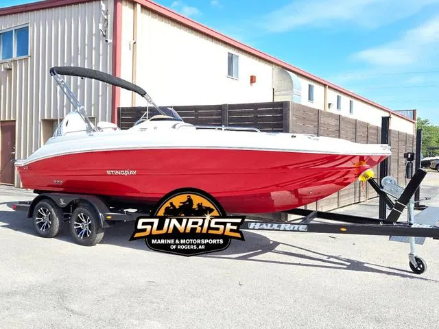 Slide: The Image of 2023 Stingray 192 SC boat on trailer at Sunrise Marine, Rogers, AR. - 2