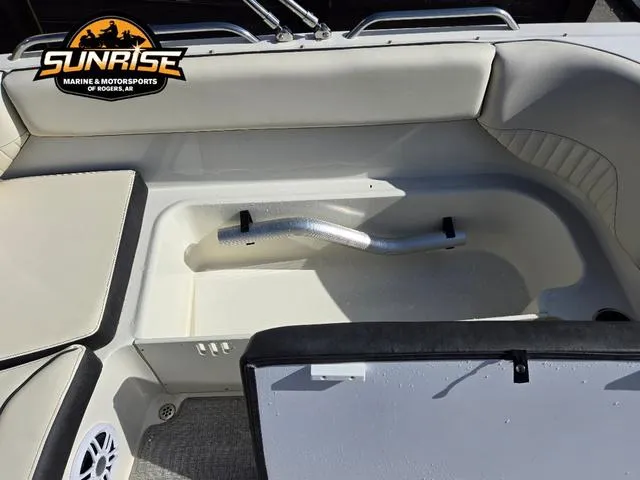 Slide: The Image of 2023 Stingray 192 SC boat interior with storage compartment, Sunrise Marine logo visible. - 22