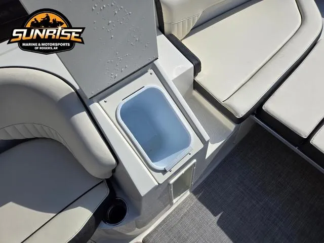 Slide: The Image of 2023 Stingray 192 SC boat interior with seating and storage compartment. - 8
