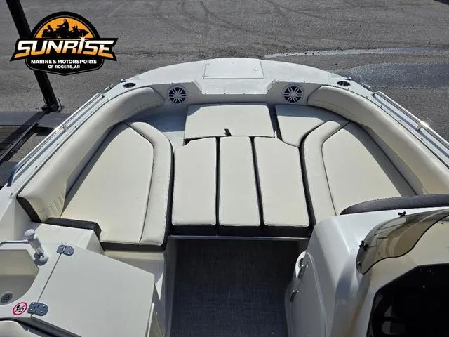 Slide: The Image of 2023 Stingray 192 SC boat interior with cushioned seating, showcased by Sunrise Marine & Motorsports. - 9