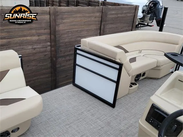 Slide: The Image of 2024 SunCatcher Select 320RCX pontoon boat interior with beige seating and wood accents. - 14