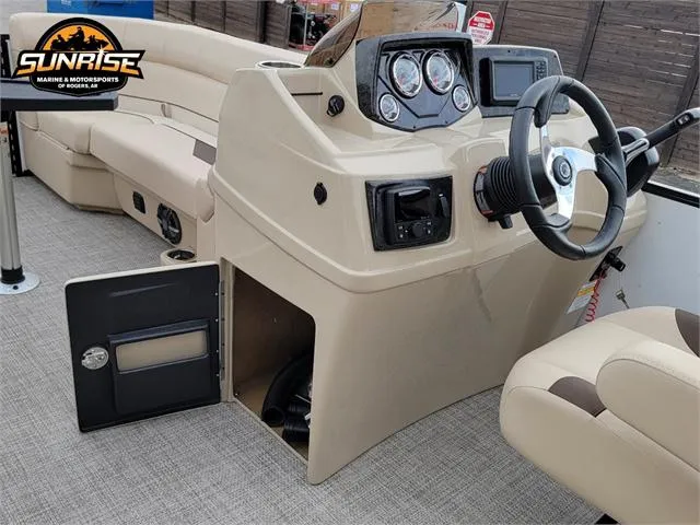 Slide: The Image of 2024 SunCatcher Select 320RCX boat interior with steering console and seating. - 16