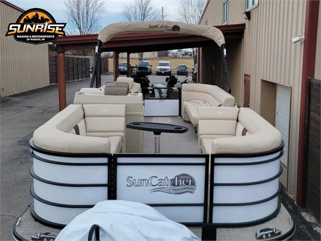 Slide: The Image of 2024 SunCatcher Select 320RCX pontoon boat with beige seating, docked at Sunrise Marine. - 22